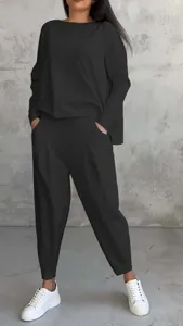 Detailed view of the casual black long sleeve top and matching harem pants set in a relaxed fit.