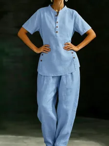 Detailed view of the casual linen two piece set featuring short sleeve button shirt pants.