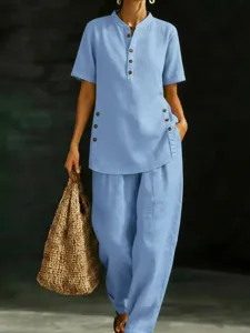 Light blue linen two-piece set featuring a short sleeve button shirt and wide leg pants.