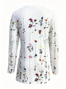 Back view detail of white long sleeve top featuring colorful vertical wildflower print.