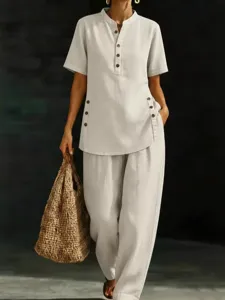 Detailed view of the casual linen two-piece set featuring a button-up shirt and wide-leg pants.