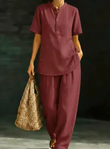 Casual linen two-piece set featuring a short sleeve button-up tunic and matching wide leg pants.
