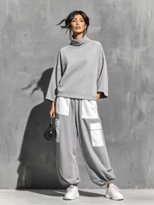 Women's high neck sweatshirt and loose cargo pants two piece set for autumn winter.