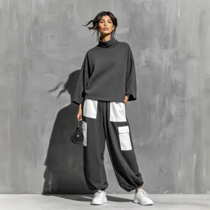 Women's high neck sweatshirt and loose cargo pants two piece set with contrast pocket design.