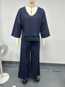 Casual navy blue two-piece linen set for women, featuring a V-neck top and loose wide-leg pants.