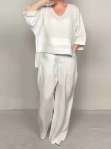 Casual solid color cotton linen two-piece set featuring a loose V-neck top and wide pants.
