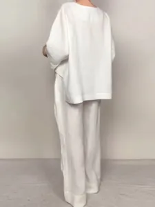 Detail view of the white linen cotton casual loose two-piece top and trousers set for women.