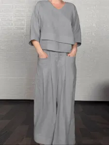 Womens casual solid color linen two piece set, V-neck top and wide leg pants detail view.