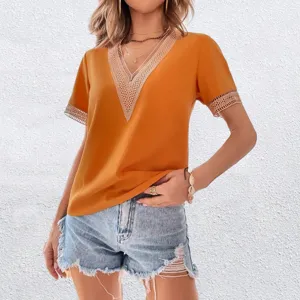 Detailed view of the elegant V-neck short sleeve top featuring delicate lace trim and soft fabric.