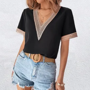 Close-up detail of women's black V-neck short sleeve top with delicate contrast lace trim.