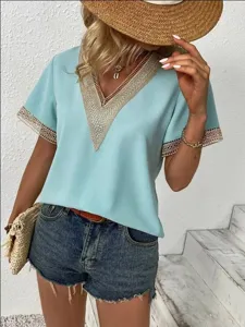 Close-up of the elegant V-neck lace trim short sleeve top in light blue, chic and stylish.