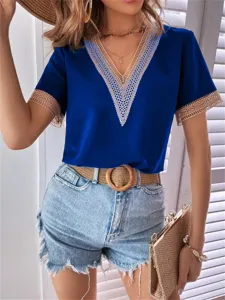 Close-up detail of the elegant V-neck short-sleeve top featuring delicate lace trim in blue.