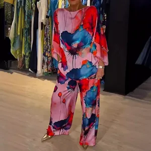 Elegant floral print satin two piece set featuring a loose blouse and wide leg pants.