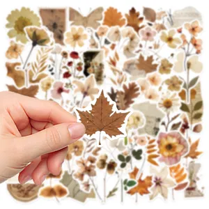 Close-up of vintage botanical maple leaf sticker with retro floral background collection.