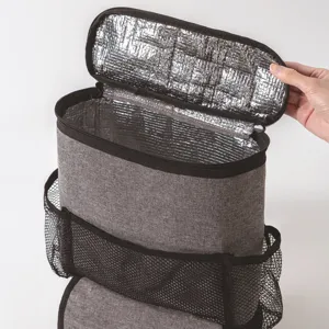 Insulated car organizer detail showing silver foil interior lining and mesh side pockets.