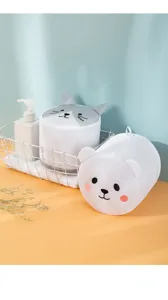 Detail shot of cute cartoon mesh laundry bags, cylindrical cat and bear designs for underwear.