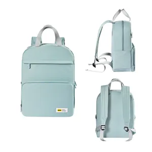 Light blue casual travel backpack with multiple compartments, top handle and adjustable straps.