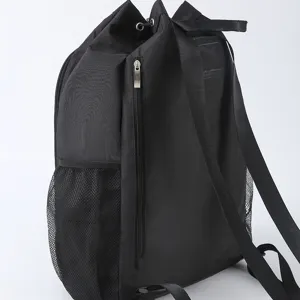 Black waterproof drawstring backpack with mesh side pockets and vertical zipper for sports travel.