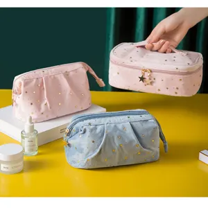 Velvet cosmetic bag with gold star print, soft portable makeup organizer pouch for travel.