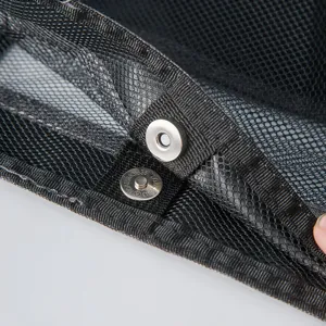 Black mesh outdoor beach bag detail view with metal magnetic snap button closure.