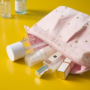 Pink velvet cosmetic bag with gold star prints, portable makeup storage travel pouch.