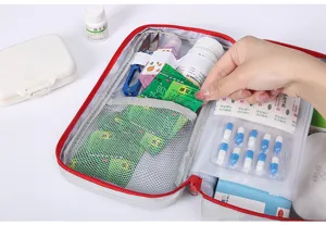 Detailed view of portable first aid medical bag interior showing organized storage pockets.