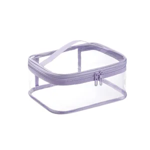 Bolsa de maquillaje transparente de PVC impermeable con borde morado y doble cremallera.