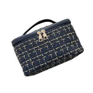 Large capacity tweed cosmetic bag with double zippers and top handle for women daily travel.