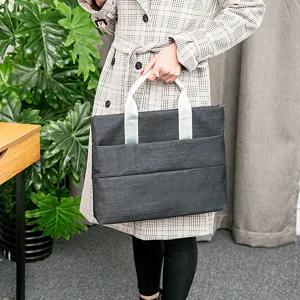 Sacoche d'ordinateur portable gris foncé durable pour usage professionnel, étui léger pour tablette.