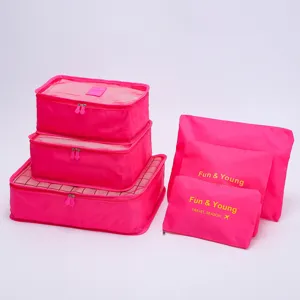 Juego de 6 organizadores de viaje en rosa fucsia con diseño de malla para maletas.