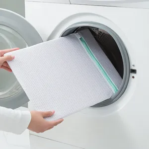 White mesh laundry bag with green zipper for washing machine clothes protection and daily storage.