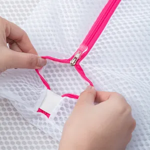 White mesh laundry bag with pink zipper for delicate clothes washing and daily storage main view