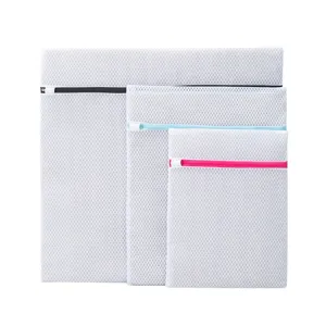 Set of 3 white mesh laundry bags with colorful zippers for delicate clothes washing and storage.