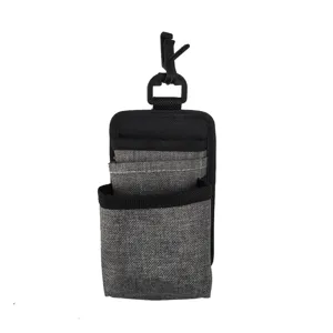 Detail view of gray fabric car vent storage bag with multi pockets and hanging hook.