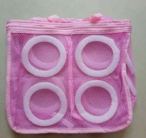 Detailed view of the pink mesh shoe washing bag with internal circular support rings for laundry.