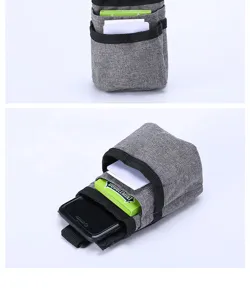 Car air vent storage bag detail view, multi-pocket pouch for phone and cards, grey fabric.