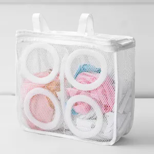 Mesh shoe washing bag detail showing durable mesh fabric, zipper closure and protective rings.