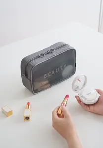 Borsa cosmetica in rete grigia con doppia cerniera, custodia portatile per trucchi e accessori.