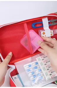 Portable first aid bag emergency medical storage pouch travel organizer with mesh pockets.