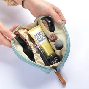 Bolsa de maquillaje semiredonda impermeable para mujer, estuche de almacenamiento portátil.