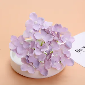 Artificial purple hydrangea flower head detail, silk floral DIY material for wedding decor.