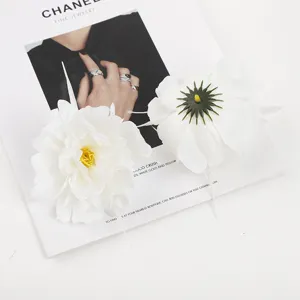 Close-up detail of white artificial silk peony flowers, perfect for wedding and home decor.