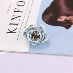 Detailed close-up of a dust blue artificial rose flower head, perfect for photography prop.