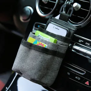 Car vent organizer pouch for smartphone and cards, durable grey fabric car air vent storage bag.