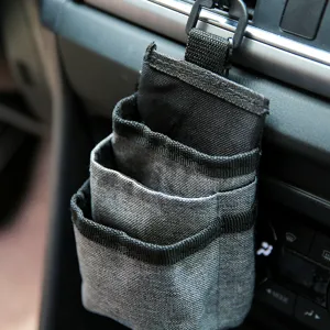Car air vent storage bag multi-layer portable organizer holder for phone and cable.