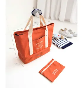 Grote capaciteit canvas reizen opbergtas set in orange met handvatten en bijpassende pouch.