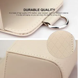 Car air vent storage bag detail, beige PU leather organizer for phone, key, and glasses.