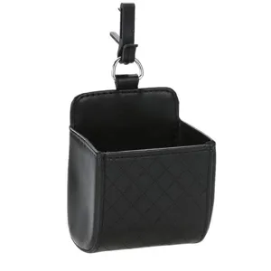Car air vent storage bag detail view, black leather organizer pocket for phone and keys.