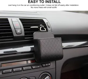 Car air vent storage bag detail view, hanging on dash outlet, faux leather organizer.
