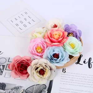 Colorful artificial rose flower heads for home decoration, wedding props and photography.